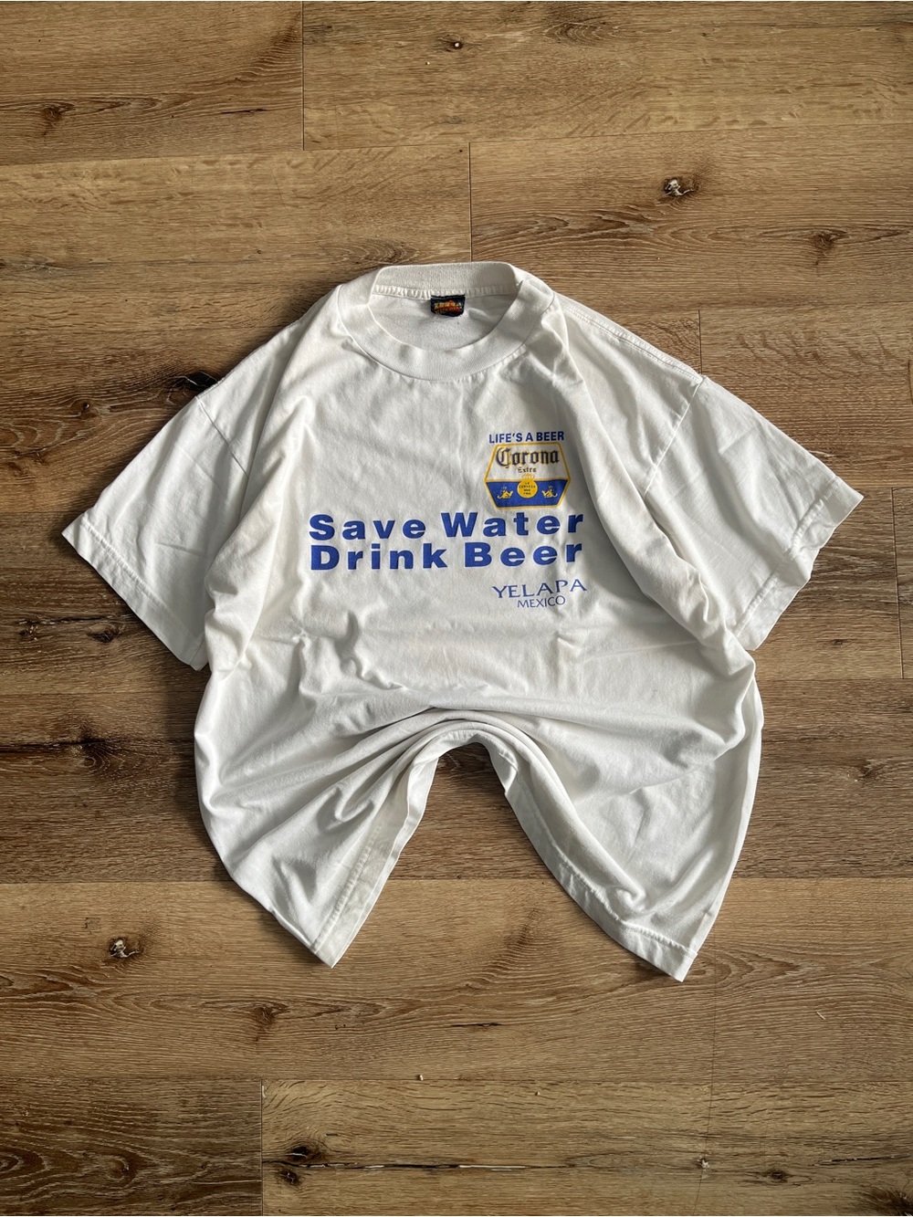 Corona Kids White Swim Tee with Blue and Yellow Logo